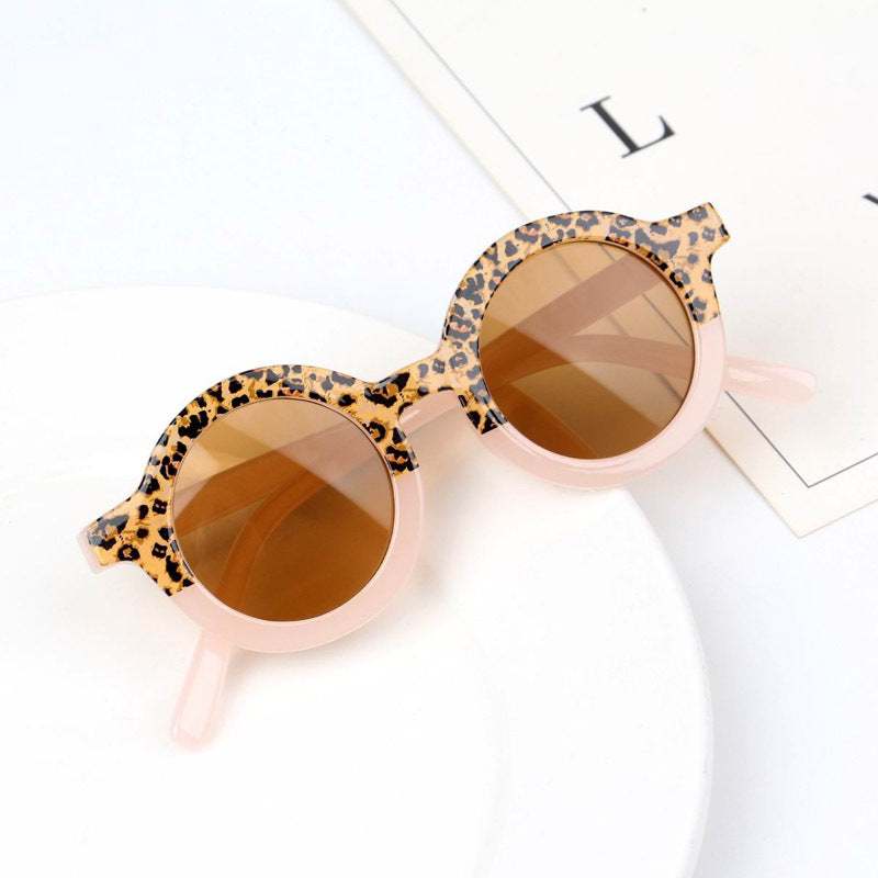 Children's Fashion Round Leopard Print Patchwork ShadesProduct Information:


 Material: PC
 
 Style: fashion retro
 
 Frame material: PC
 
 Lens material: resin
 
 Anti-UV grade: 400
 
 Visible light perspective rate: 80Stef's Store